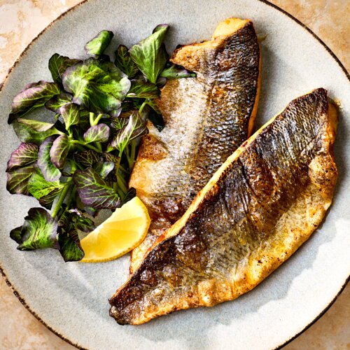 Photo of Simply Roasted Branzino from Chios Taverna by Michael Symon